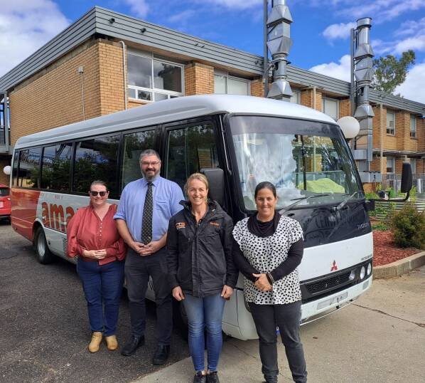 Canowindra High School staff and principal with their new school bus.