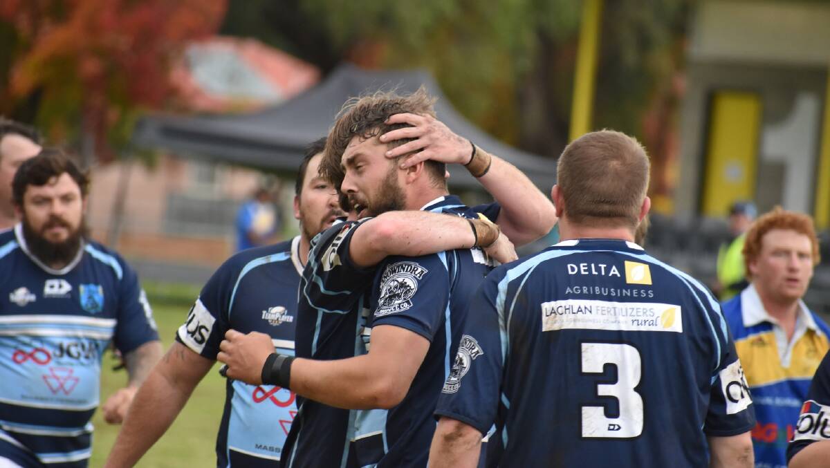 Tye Ashe is congratulated by his team mates after scoring for the Pythons last weekend. Photo Jen Sheridan.