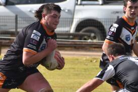 Junior Tiger Cooper Scifleet takes on the Cowra defence in his side's narrow loss to the Cowra Magpies. Photo Andrew Fisher.