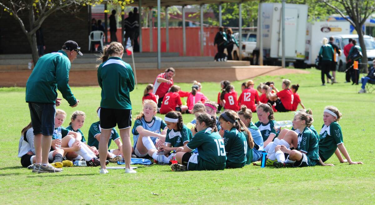 Paul Morris talks to his Western under 12s side back at the 2011 NSW Girls Championships in Dubbo. Picture by Amy McIntyre.